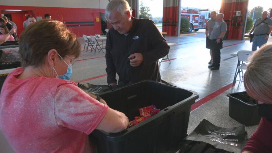 Volunteers pack candy bags for Zoneton Fire Halloween 2021.jpeg