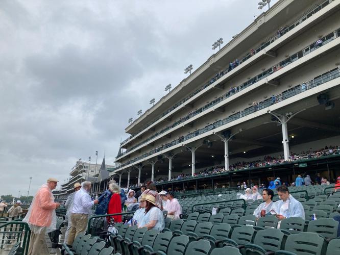 Fans in ponchos in the stands at Churchill Downs for Derby 151 5-3-25