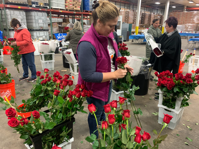 Kroger worker with roses at Middletown warehouse