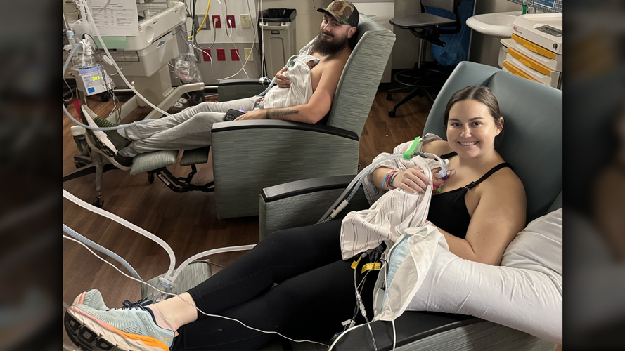 Austin and Jillian Myers smile with their identical twin sons