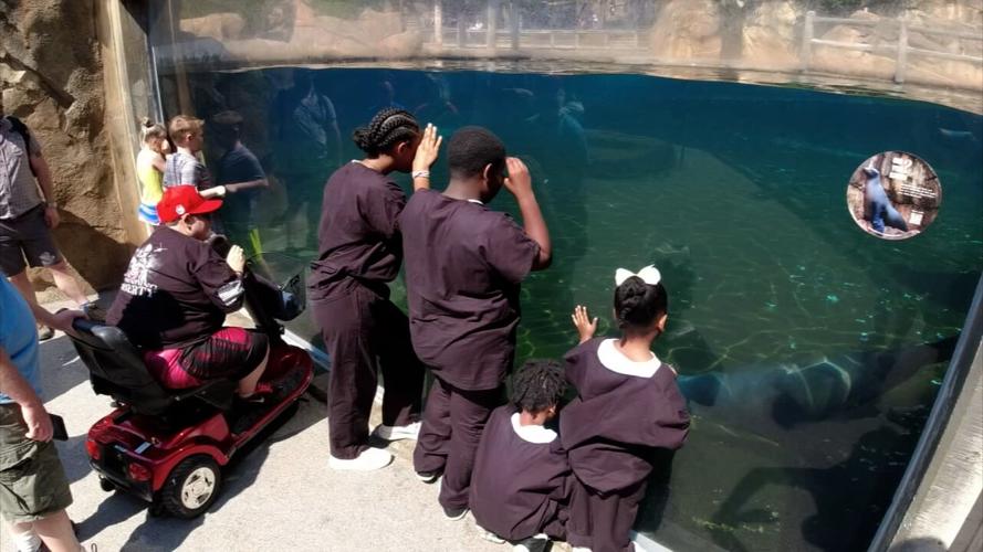 Master P with children taking part in Christopher 2X's Future Healers program at the Louisville Zoo