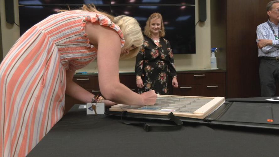 Chefs from the Sullivan University's culinary school signed a NASA locker that will be flown to the International Space Station