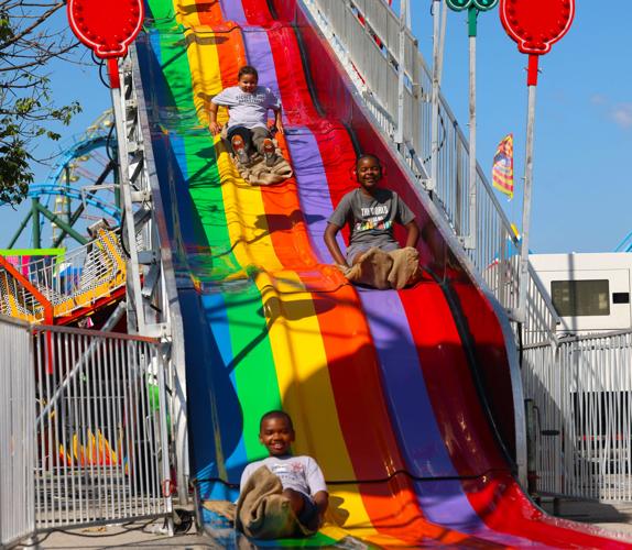 Children go down slide at Sensory Awareness Day.JPG