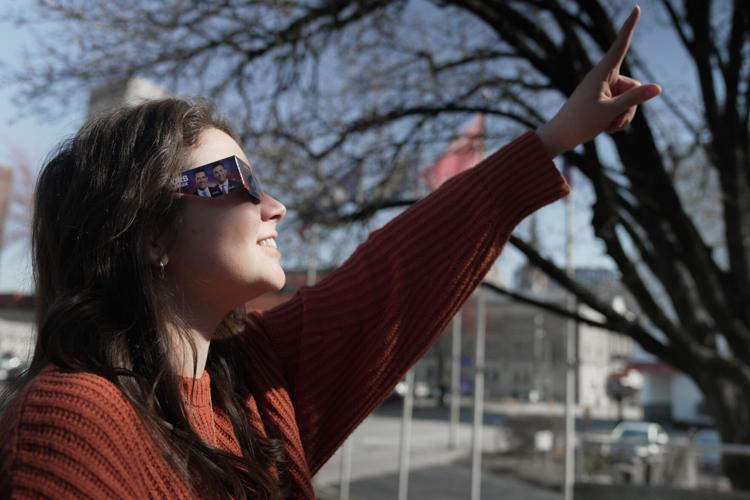 eclipse glasses pointing.jpg