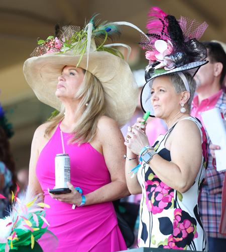 Women look on during race at Oaks.JPG