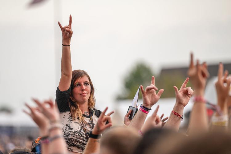 A fan with horns up at the Louder Than Life Festival on September, 21, 2025 in Louisville, Kentucky (52 of 175).jpg