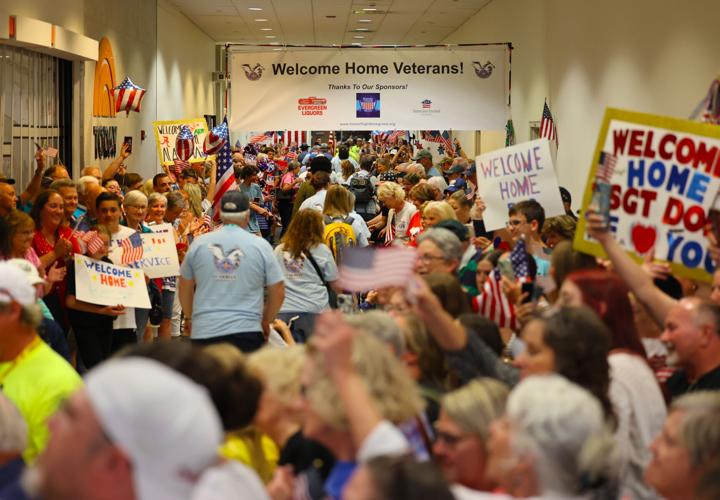 People crowd SDF as Honor Flight veterans return home.JPG