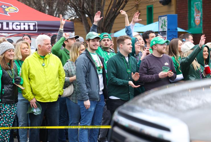 Crowd waves at trucks during St. Patrick's Day Parade.JPG