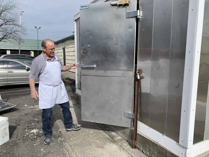 The Hungry Pelican's Al Feige shows off his refrigerator full of fish