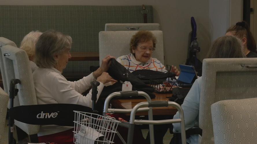 SENIORS STUFFING BACKPACKS FOR KIDS.jpeg