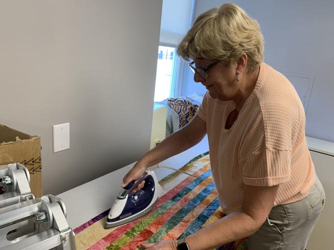 Women from the St. Joseph Ladies Sewing Society sew quilts for the St. Joseph Children's Home