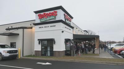 Customers waiting in line for grand opening of Louisville's first LaRosa's Pizza location