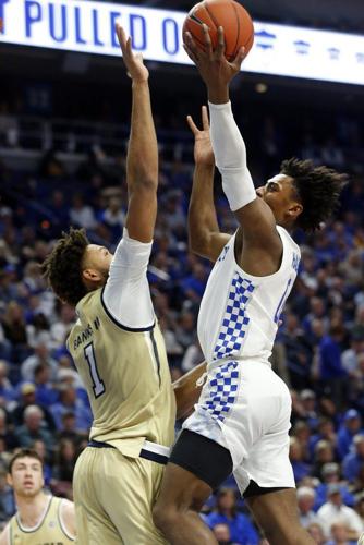 Kentucky's Ashton Hagans, right, shoots while pressured by Georgia Tech's James Banks III