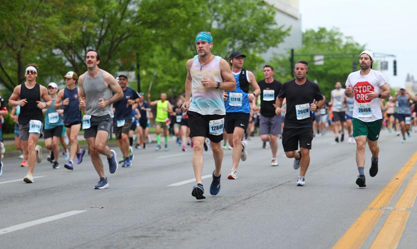 Marathon runners go down Broadway.JPG