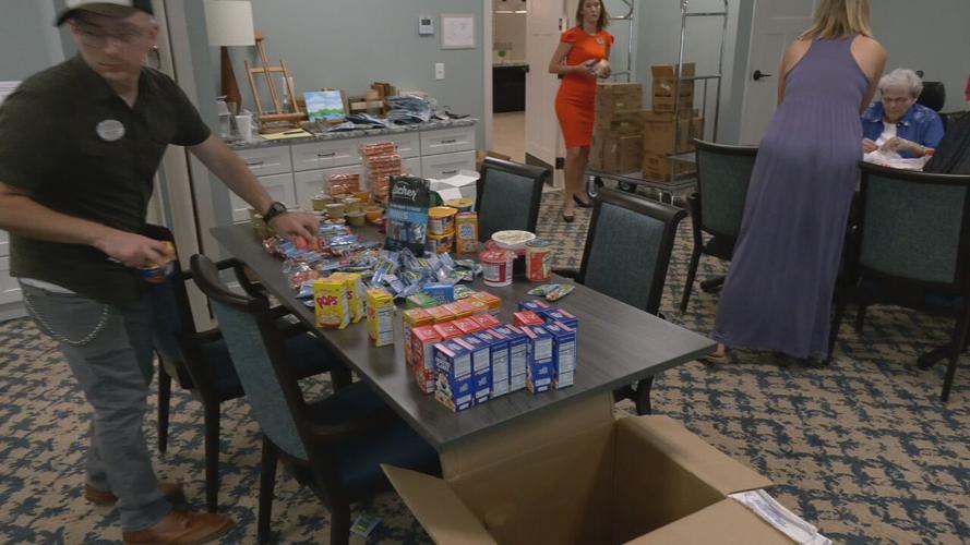 SENIORS STUFFING BACKPACKS FOR KIDS.jpeg