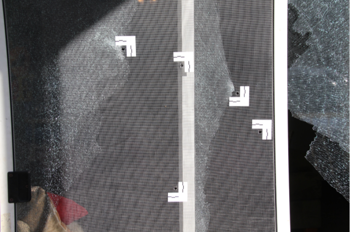 Bullet holes in porch screen of Breonna Taylor's apartment
