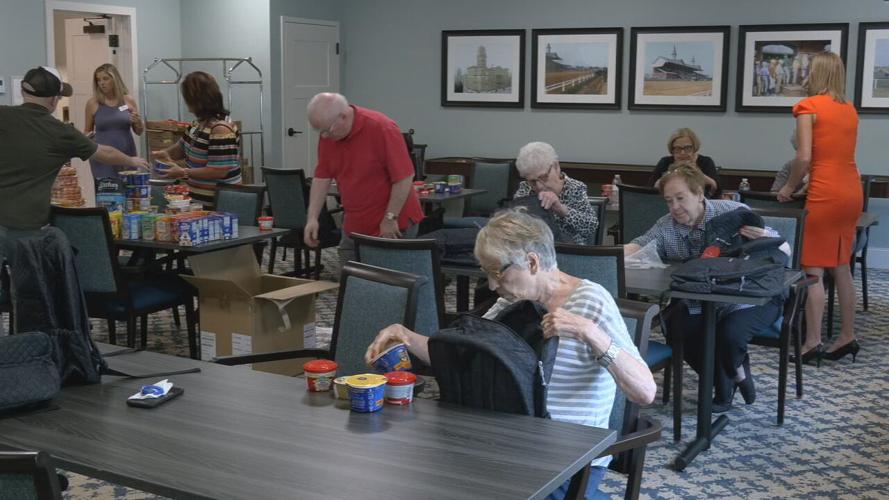 SENIORS STUFFING BACKPACKS FOR KIDS.jpeg