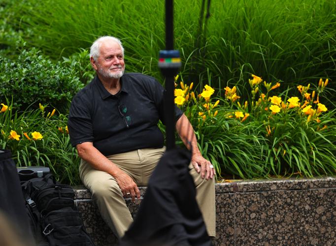 Lloyd Gardner sits at Hometown Heroes unveiling.JPG
