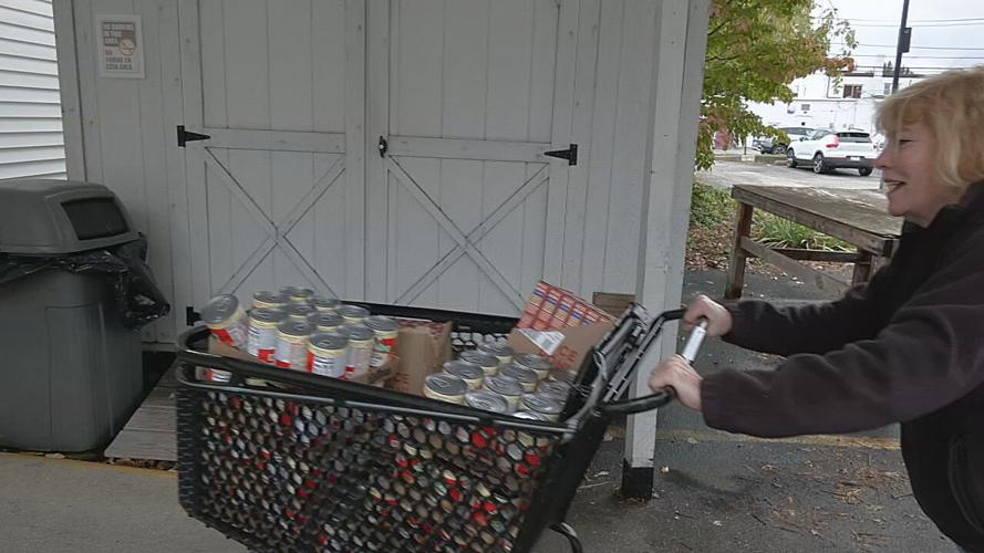 Indiana resident pushes cart with donated food