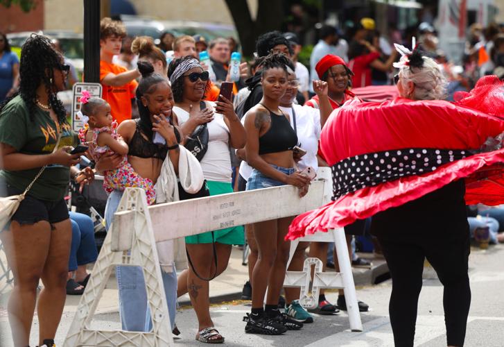 People take photos of Derby hat.JPG