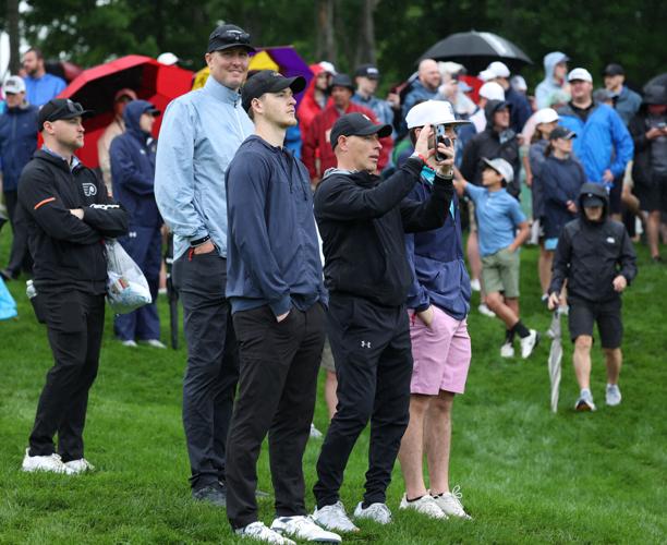 Fans hold up phone at Valhalla Golf Club.JPG