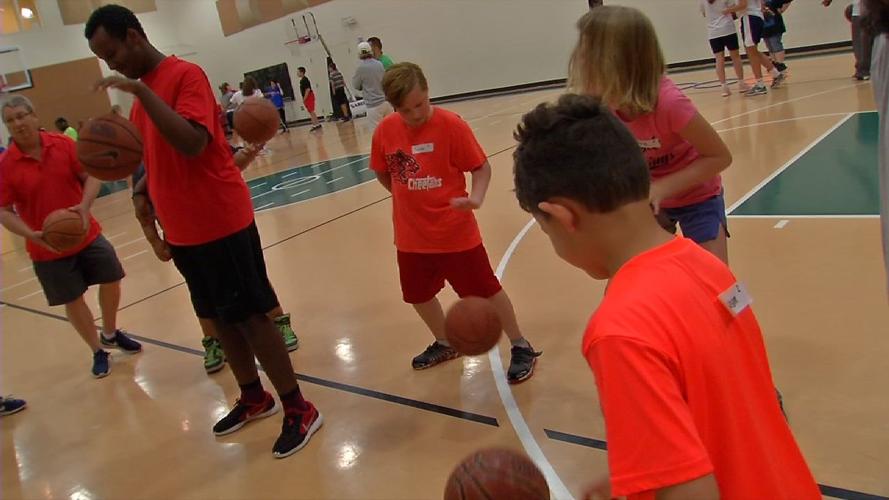 Kids participate in drills at Luke Hancock's basketball camp