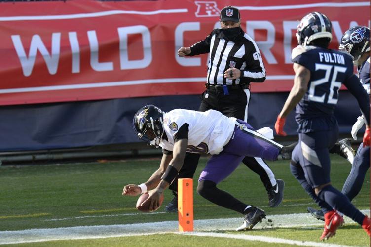 Baltimore Ravens quarterback Lamar Jackson (8) scores a touchdown