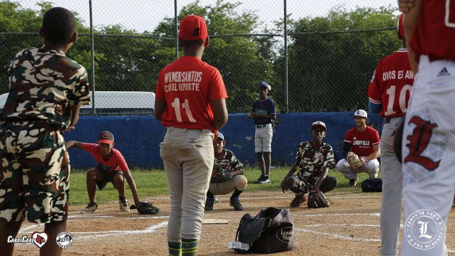 Louisville baseball teaching kids in DR