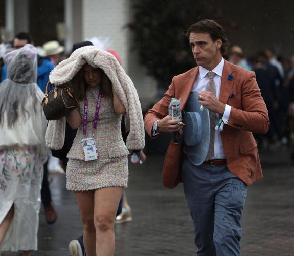 Two people cover from rain.JPG