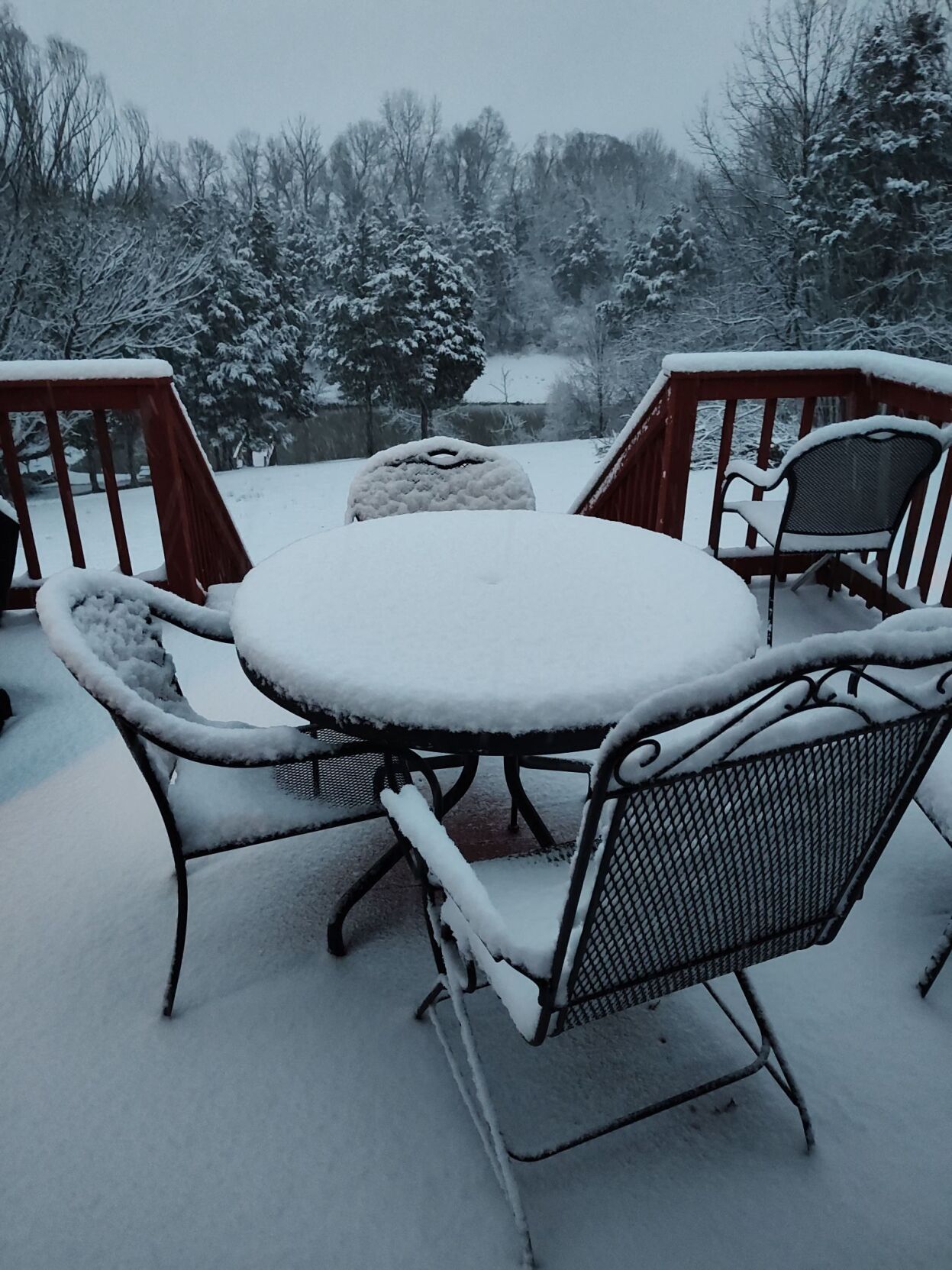 Snow-covered patio furniture in Bardstown
