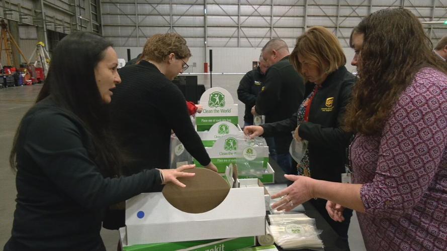 UPS employees packing hygiene kits for the homeless on April 19, 2022