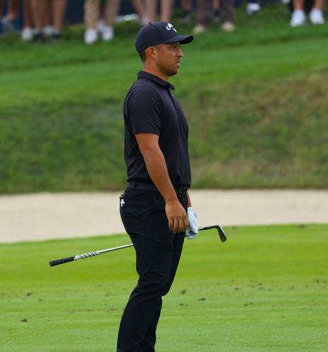 Xander Schauffele watches a shot.JPG