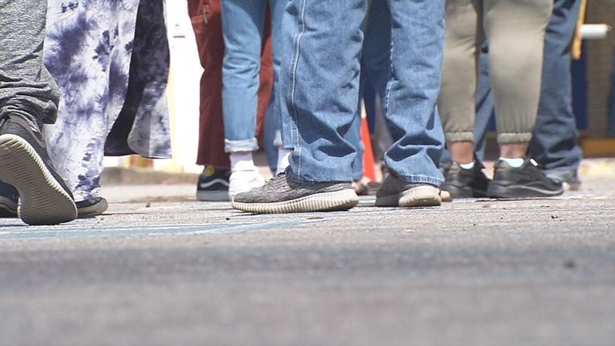 Kentuckians wait for in-person assistance with unemployment benefits outside Louisville's downtown office
