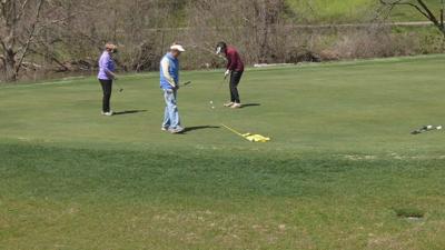 Golfers on the green at Seneca Golf Course