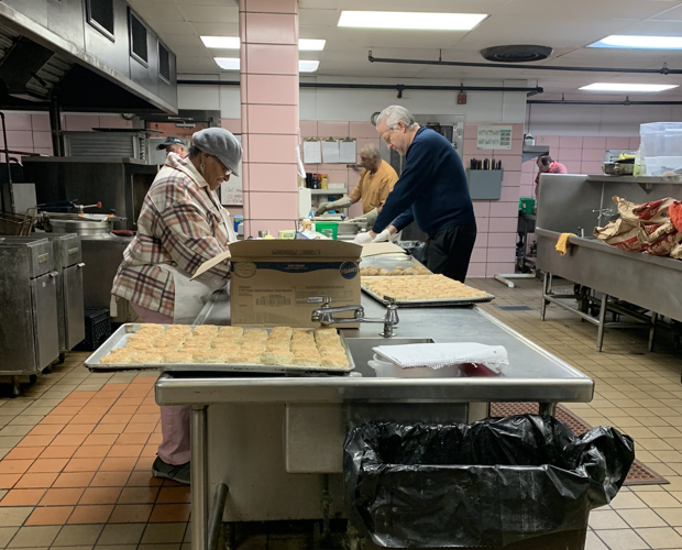 Volunteers prepare Thanksgiving meals at Wayside Christian Mission in Louisville