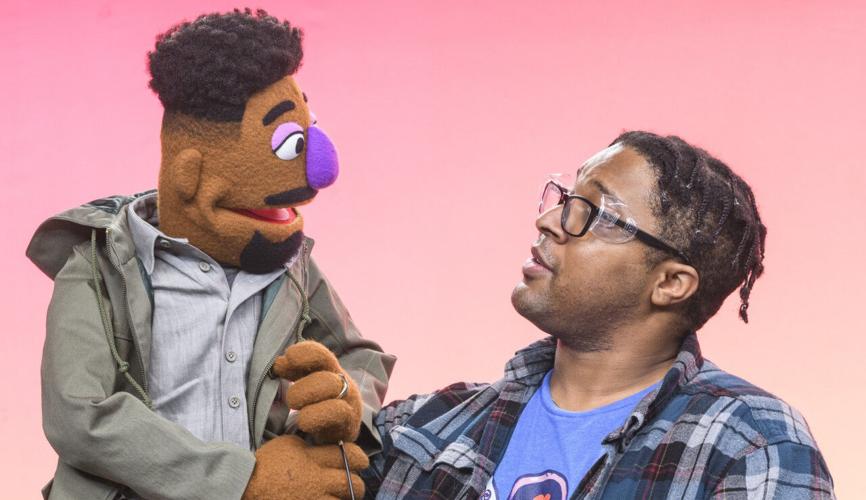 Chris Thomas Hayes with muppet Elijah