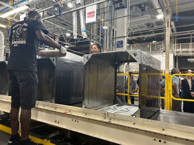 GE worker on assembly line