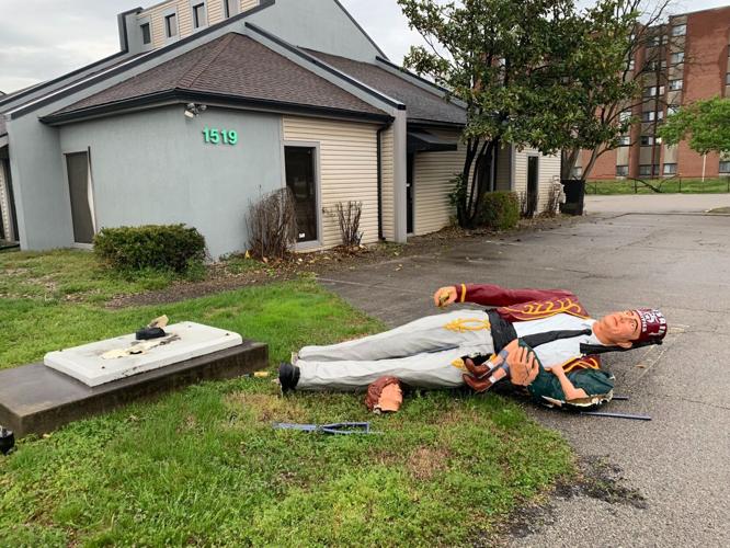 Toppled Kosair 'Silent Messenger' statue on Gardiner Lane