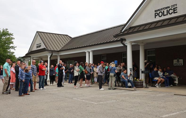 Crowd watches Jason Ellis memorial.JPG