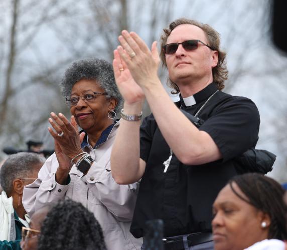 Two people clap during March on Frankfort.JPG