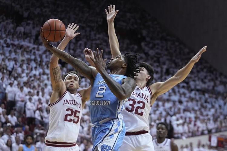 North Carolina guard Caleb Love drives to the basket against Indiana
