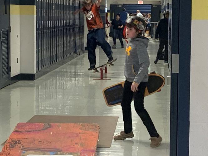 Skateboarding inside East Middle 3