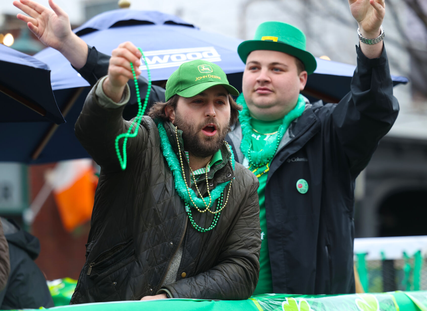 Men toss beads at St. Patrick's Day Parade.JPG