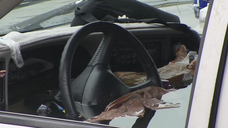 Water flooding a submerged truck after crashing into pond