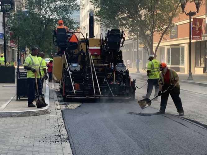 Louisville Metro Public Works crews pave a downtown Louisville road on July 26, 2023