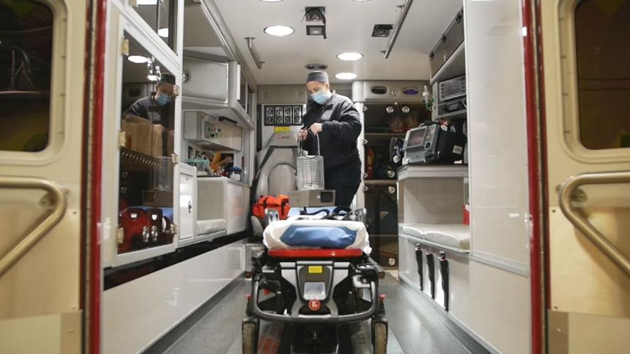 Lt. Paramedic Abby Bailey with Buechel Fire-EMS works on board an ambulance