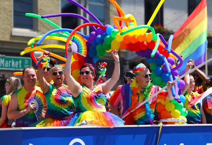 Kroger float waves at Kentuckiana Pride Parade