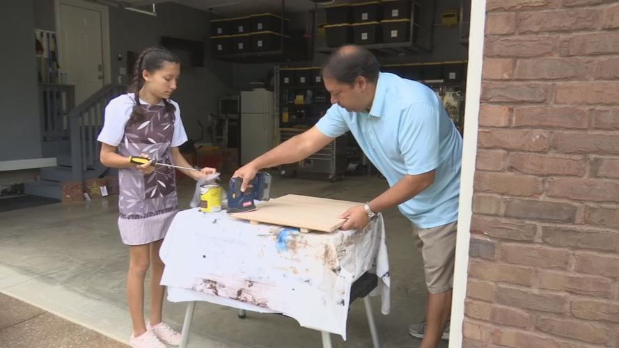 Megan Chelliah and father, Brian Chelliah, work on string art creations