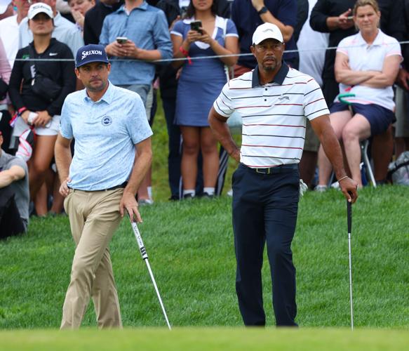 Tiger Woods waits on a green.JPG