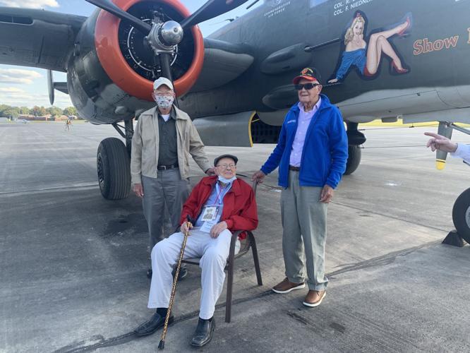 Kentucky WWII veterans stand in front of B-25 bomber